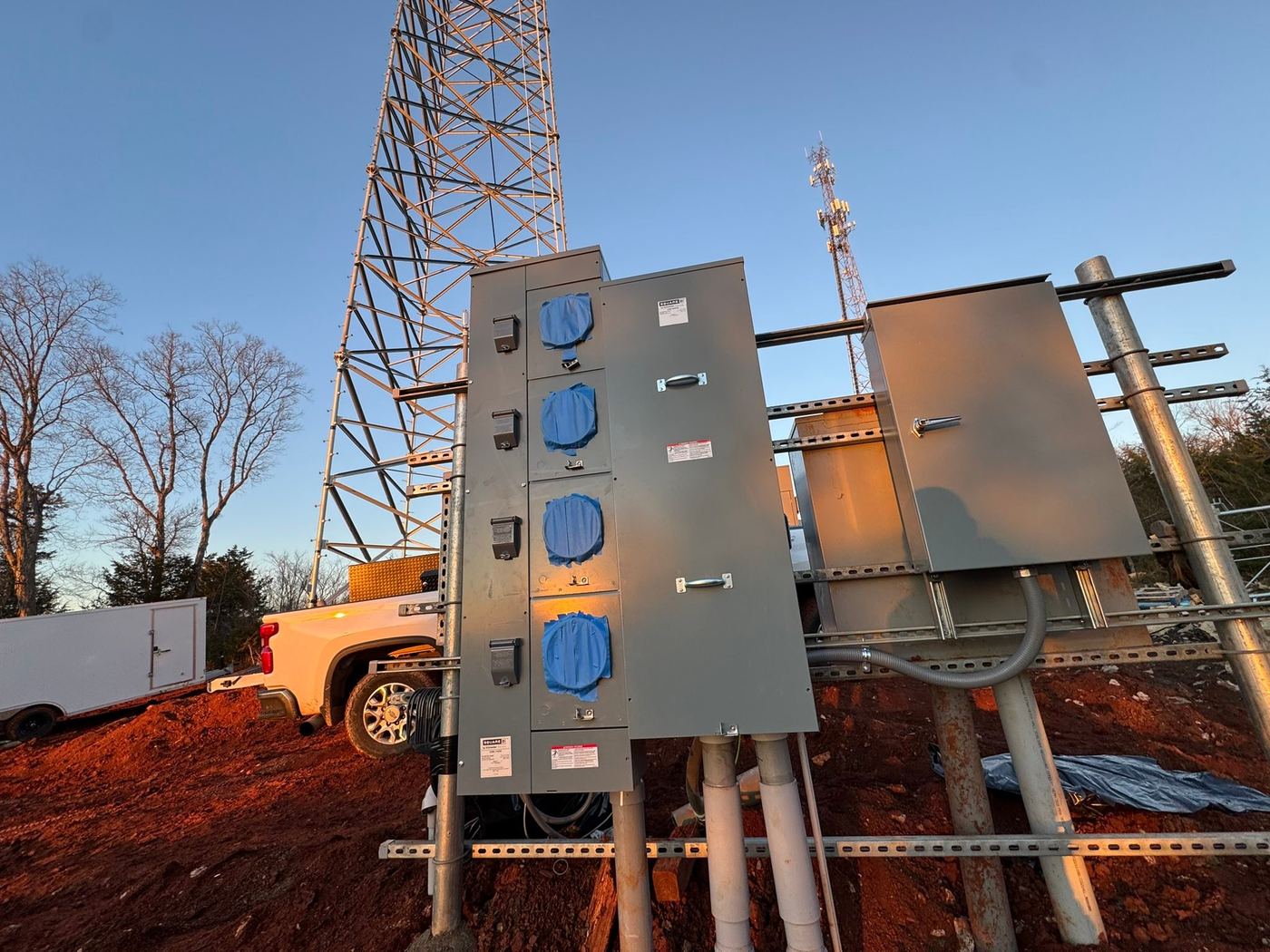 800A multi-meter service racks installed by Circle P at a tower site at sunset